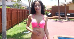 Cute brunette bitch in pink bikini strip - Picture 1