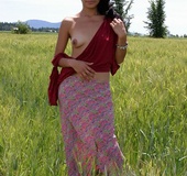 Sweet babe peels down her red blouse and shows her small tits and alluring