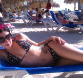 Pretty brunette with pink in sexy black bikinis flaunt tattooed shapely