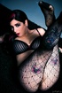 Hot tattooed brunette in black bra and net tights flaunts hairy cunt and