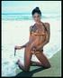Bikini-clad babes posing and getting fucked during an orgy