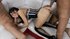 Petite slut in stockings and a corset takes two dicks at once on a couch