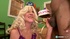 Mature blonde with big hooters teasing in purple lingerie and black stockings