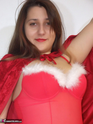 Cute babe teases with her chubby body in different poses wearing her red and white santa hat, nighty, red cape, panty and red and clear high heels on a red bed. - XXXonXXX - Pic 3