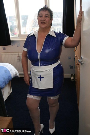 Plus size nurse teases her old patient with her large body in blue and white uniform, white stockings and high heels then lets him lick her humongous tits before she sucks his dick on a blue bed. - XXXonXXX - Pic 1