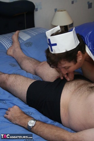 Plus size nurse teases her old patient with her large body in blue and white uniform, white stockings and high heels then lets him lick her humongous tits before she sucks his dick on a blue bed. - XXXonXXX - Pic 19