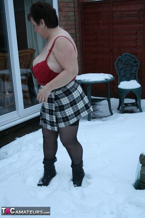 Gorgeous plomper slowly takes off her black coat, shirt and black and white skirt then displays her chubby body in red lingerie, black stockings and boots before she expose her monster boobs and sweet crack in the snow. - XXXonXXX - Pic 7