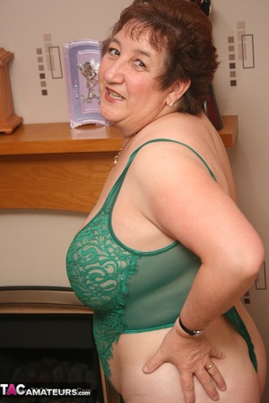 Hot granny displays her humongous body in green lingerie, black stockings and high heels before she expose her monster tits and juicy pussy in different poses on the floor. - XXXonXXX - Pic 3