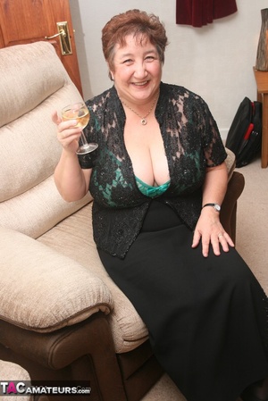 Steaming hot granny peels off her black blouse and skirt then pose her plus size body in green lingerie, black stockings and high heels. - XXXonXXX - Pic 4