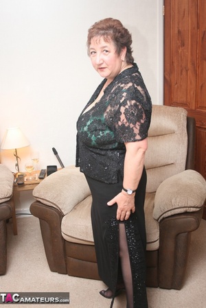 Steaming hot granny peels off her black blouse and skirt then pose her plus size body in green lingerie, black stockings and high heels. - XXXonXXX - Pic 7