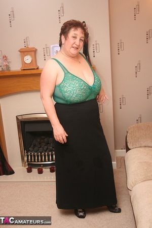 Steaming hot granny peels off her black blouse and skirt then pose her plus size body in green lingerie, black stockings and high heels. - XXXonXXX - Pic 15