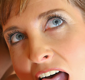 Short haired granny in black stockings gets facialized after being fucked