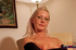 Blonde granny in glasses and black stockings toying her shaved pussy with