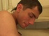 Two young men are standing on the knees and sucking a dick