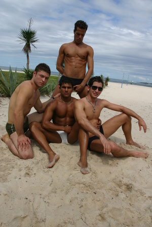 Four gays boyfriends are posing in panties on the beach - Picture 1