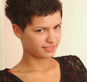 Short haired brunette with red nails and pierced belly sheds red panty