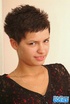 Short haired brunette with red nails and pierced belly sheds red panty