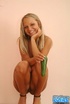 High heeled blonde with blue eyes wiggles out of white undies on the table