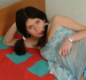 Black haired gf with pigtails taking off blue peignoir on the bed and