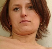 Small tits brunette wiggles out of black undies and fingering her bushy
