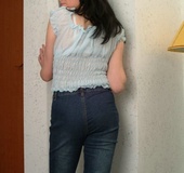 Black haired babe sheds her blue top and white undies before posing nude