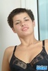 Short haired babe with red nails wiggles out of black lingerie and touching