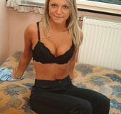 Big tits blonde in black pants and underwear got nude on the sofa and