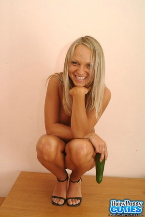 Blue eyed blonde sucking cucumber on the chair before undressing and toying her hairy vagina on the table - XXXonXXX - Pic 12