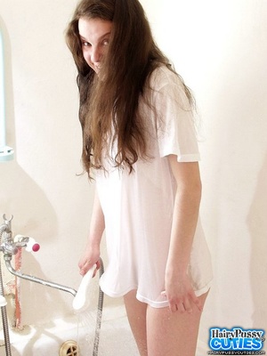 Brunette teen with perky tits and hairy coochie teasing in wet t-shirt while taking a bath - XXXonXXX - Pic 1