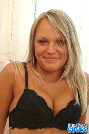 Big breasted blonde with blue eyes taking off her black pants and lingerie before fingering her hairy pussy on the sofa - XXXonXXX - Pic 7