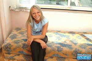 Hairy pussy blonde with blue eyes and big naturals undressing on the sofa and masturbating - Picture 1