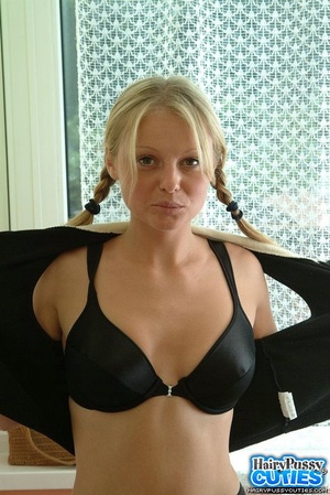 Big tits blonde with pigtails took off black underwear and showing her bushy twat by the window - XXXonXXX - Pic 2