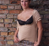 Redhead babe with big naturals sheds black underwear and miniskirt to