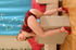 Two pale blondes in red posing together before gape
