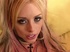 fishnets-wearing blonde with pink