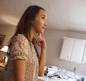 Asian girl talks to her french friend eating at the dinner table