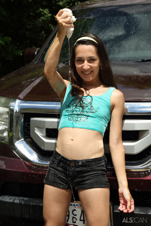 Grey eyed brunette washing car outdoors  - Picture 3