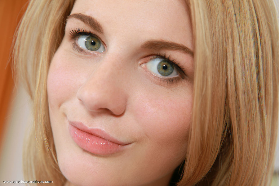 Green eyed blonde with small breast posing naked on the red couch and exposing her shaved pussy - XXXonXXX - Pic 9