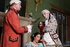 Elegant MILF sheds a Victorian dress before sexing up a younger stud.
