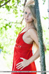Blue eyed blonde in red dress and no panty stripteasing in the forest