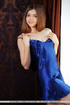 Brunette teen taking off blue peignoir and exposing big naturals before