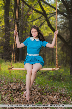Brunette teen in blue dress swinging out - Picture 2