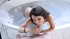 Gorgeous babe gets  a visitor while she is in the bathtub, he fucks her