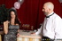 Busty brunette gets fucked in the coat room by a waiter.