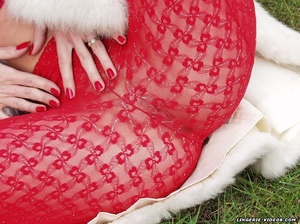 Alluring babe pose her stunning body outdoor wearing her white furry coat, red bra and glass high heels before she pulls down her red pantyhose and bares her indulging pussy on the grass. - XXXonXXX - Pic 7