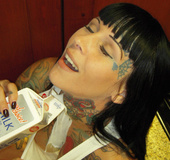Banging babe displays her steaming hot tattooed body while she eats her