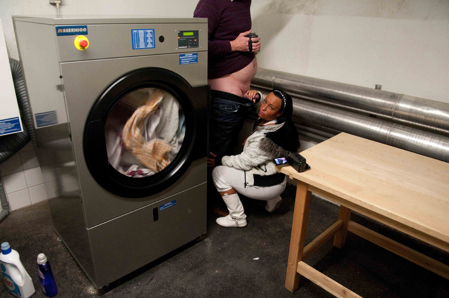 Babe with a freckled face films herself fucking a protected dick in the laundry room - XXXonXXX - Pic 3