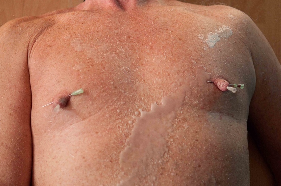 Masked slave is being bent over while his nipples are being pierced brutally - XXXonXXX - Pic 10