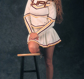 Smoking hot cheerleader pose her foxy body then expose her big tits before