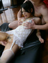 Seductive brunette wearing white lace stockings and undergarment having